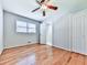 Inviting bedroom featuring hardwood floors, a ceiling fan, and a closet with a bright, airy feel at 4307 Smithsonia Ct, Tucker, GA 30084