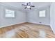 Bedroom with natural light, hardwood floors, a ceiling fan, and neutral paint at 4307 Smithsonia Ct, Tucker, GA 30084