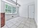 Bright dining area with large windows and tile flooring offers ample natural light and space at 4307 Smithsonia Ct, Tucker, GA 30084