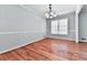 Empty dining room featuring hardwood floors, natural lighting, and neutral walls at 4307 Smithsonia Ct, Tucker, GA 30084