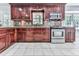 Kitchen featuring stainless appliances, granite countertops, and dark wood cabinetry at 4307 Smithsonia Ct, Tucker, GA 30084