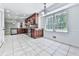 Open kitchen and breakfast area features custom cabinets, granite countertops and stainless steel appliances at 4307 Smithsonia Ct, Tucker, GA 30084