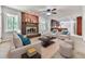 Cozy living room featuring a brick fireplace, ceiling fan and neutral furniture and decor at 4307 Smithsonia Ct, Tucker, GA 30084