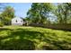 Large backyard showcasing a spacious green lawn and a tall privacy fence, ideal for outdoor activities at 1084 Regent Sw St, Atlanta, GA 30310