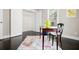 Bright bedroom featuring dark hardwood floors, a patterned rug, and a closet for ample storage at 1084 Regent Sw St, Atlanta, GA 30310
