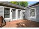 Spacious wooden deck featuring multiple doors and windows, perfect for outdoor entertaining and relaxation at 1084 Regent Sw St, Atlanta, GA 30310