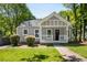 Inviting exterior featuring a well-manicured lawn and a cozy front porch perfect for enjoying the outdoors at 1084 Regent Sw St, Atlanta, GA 30310
