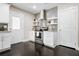 Modern kitchen featuring stainless steel appliances, white cabinetry, and a sleek tile backsplash at 1084 Regent Sw St, Atlanta, GA 30310
