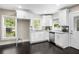 Modern kitchen featuring white cabinets, stainless steel appliances, and granite countertops at 1084 Regent Sw St, Atlanta, GA 30310