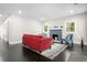 Cozy living room with a blue brick fireplace, dark floors, and lots of natural light at 1084 Regent Sw St, Atlanta, GA 30310