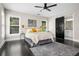 Bright main bedroom with a ceiling fan and an en-suite bathroom with sliding door at 1084 Regent Sw St, Atlanta, GA 30310