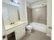 Clean bathroom with a bathtub, shower, and vanity with storage at 1794 Blossom Ln, Austell, GA 30168