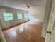 Bedroom with hardwood flooring, large windows and ceiling fan at 1794 Blossom Ln, Austell, GA 30168
