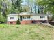 Cozy, single-story home featuring a well-manicured lawn and charming curb appeal at 1794 Blossom Ln, Austell, GA 30168