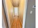 Bright hallway with hardwood floors leads to various rooms in this charming home at 1794 Blossom Ln, Austell, GA 30168
