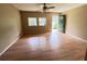 Bright living room featuring natural light, ceiling fan and hard wood floors at 1794 Blossom Ln, Austell, GA 30168