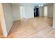 Spacious living room featuring bright walls and shiny hardwood floors at 1794 Blossom Ln, Austell, GA 30168