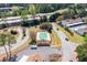 Overhead shot of community pool, amenities, and complex layout and surrounding roads and highways at 200 High Creek Dr, Roswell, GA 30076