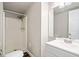 A cozy bathroom features a shower and a sleek white vanity with modern fixtures at 200 High Creek Dr, Roswell, GA 30076