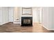Living room showing a fireplace, neutral walls and hardwood-style floors at 200 High Creek Dr, Roswell, GA 30076