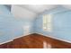 Spacious walk-in closet with custom shelving and hardwood floors at 562 Grassmeade Way, Snellville, GA 30078