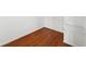 Walk-in closet with hardwood floors and built-in wire shelving, offering ample storage space at 562 Grassmeade Way, Snellville, GA 30078