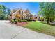 Stately brick home with meticulously maintained grounds, showcasing an inviting exterior and curb appeal at 562 Grassmeade Way, Snellville, GA 30078