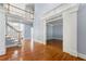 Light-filled foyer with hardwood floors and staircase leading to the second floor at 562 Grassmeade Way, Snellville, GA 30078