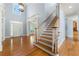 Spacious foyer with hardwood floors and staircase offers a grand welcome to the home at 562 Grassmeade Way, Snellville, GA 30078