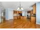 Beautiful kitchen with stainless steel appliances, granite countertops, hardwood floors, and wooden cabinets at 562 Grassmeade Way, Snellville, GA 30078