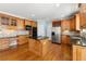 Well-appointed kitchen with stainless steel appliances, hardwood floors, and a large island at 562 Grassmeade Way, Snellville, GA 30078