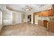 Kitchenette with ample cabinetry, granite countertops, and built-in shelves at 562 Grassmeade Way, Snellville, GA 30078