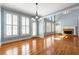 Bright open concept room featuring large windows, hardwood floors, and modern architectural details at 562 Grassmeade Way, Snellville, GA 30078