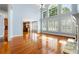 Bright living room with high ceilings, lots of windows, and hardwood floors at 562 Grassmeade Way, Snellville, GA 30078