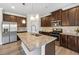 Bright kitchen features stainless steel appliances, granite countertops and a large central island at 1543 Dover Creek Ln, Lawrenceville, GA 30045