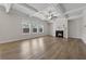 Spacious living room featuring coffered ceilings, a cozy fireplace, and an abundance of natural light at 1543 Dover Creek Ln, Lawrenceville, GA 30045