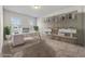 Office space with built-in shelving, a modern desk, and bright natural light from the window at 1543 Dover Creek Ln, Lawrenceville, GA 30045