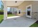 Covered patio with large concrete pad and white columns is perfect for outdoor entertaining at 1543 Dover Creek Ln, Lawrenceville, GA 30045