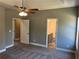 Cozy bedroom featuring neutral walls and a ceiling fan at 202 Gamel Rd, Dallas, GA 30157