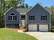 Charming two-story home with a two-car garage and manicured front lawn at 202 Gamel Rd, Dallas, GA 30157