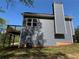 Back of the house features a nice deck and well-kept backyard at 202 Gamel Rd, Dallas, GA 30157