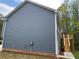 View of the rear of the home, showcasing the deck and the expansive lawn at 202 Gamel Rd, Dallas, GA 30157
