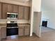 Modern kitchen with stainless steel appliances, granite countertops, and sleek cabinetry at 202 Gamel Rd, Dallas, GA 30157