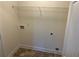 Well-lit laundry area features new vinyl flooring and hookups for appliances at 202 Gamel Rd, Dallas, GA 30157