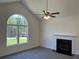 Living room with a fireplace, carpeted floors, and a large window at 202 Gamel Rd, Dallas, GA 30157