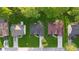 Bird's eye view of well-maintained homes, green lawns, and neighborhood streets at 290 Magnolia Walk Ln, Atlanta, GA 30349