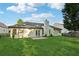 A lovely backyard features a well-maintained lawn and a white house at 290 Magnolia Walk Ln, Atlanta, GA 30349