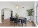 Bright dining area features hardwood floors, modern chandelier, and stylish table setting at 290 Magnolia Walk Ln, Atlanta, GA 30349