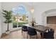 Elegant dining room with hardwood floors, chandelier, large windows, and modern decor at 290 Magnolia Walk Ln, Atlanta, GA 30349