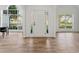 Bright entryway with hardwood floors, white walls, and large windows that offer plenty of natural light at 290 Magnolia Walk Ln, Atlanta, GA 30349